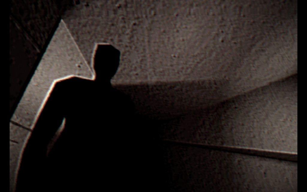 Screenshot showing the low-polygon silhouette of a figure in a doorway, against a concrete-walled room.