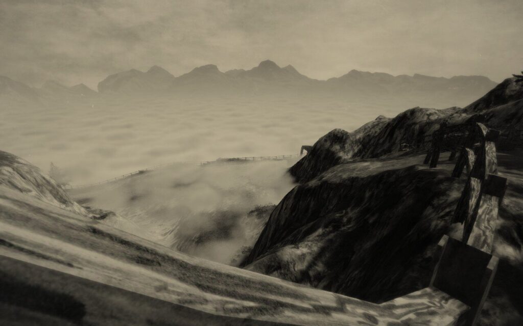 Screenshot from "Mundaun", showing mountains descending into mists, with more mountains in the far background.
